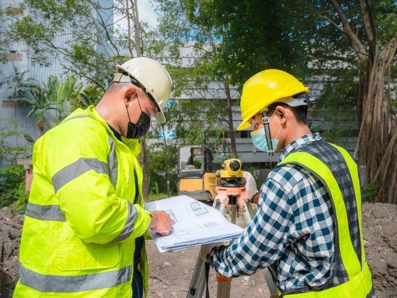 Survey professionals coordinating commercial development projects near a growing transportation corridor
